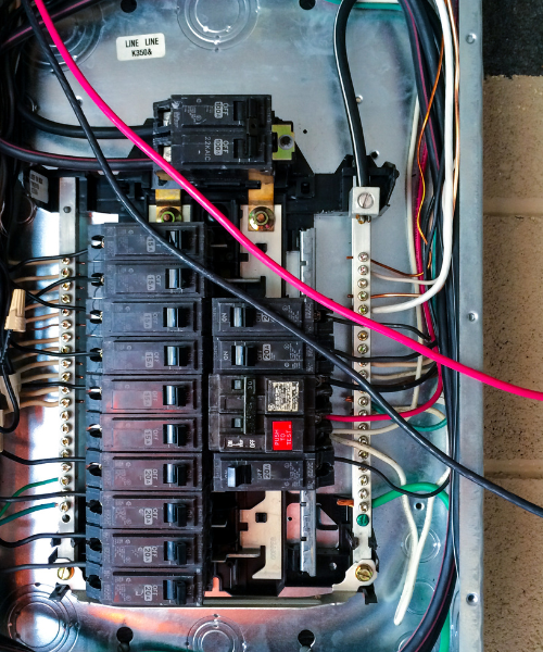 An electrical panel with multiple wires attached to it