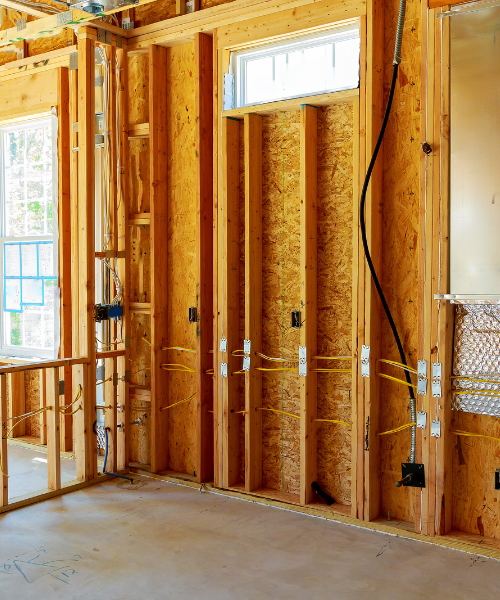 A room that is under construction with a lot of wood