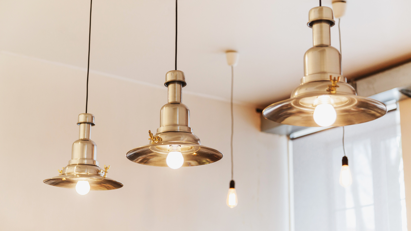 A bunch of lights hanging from a ceiling