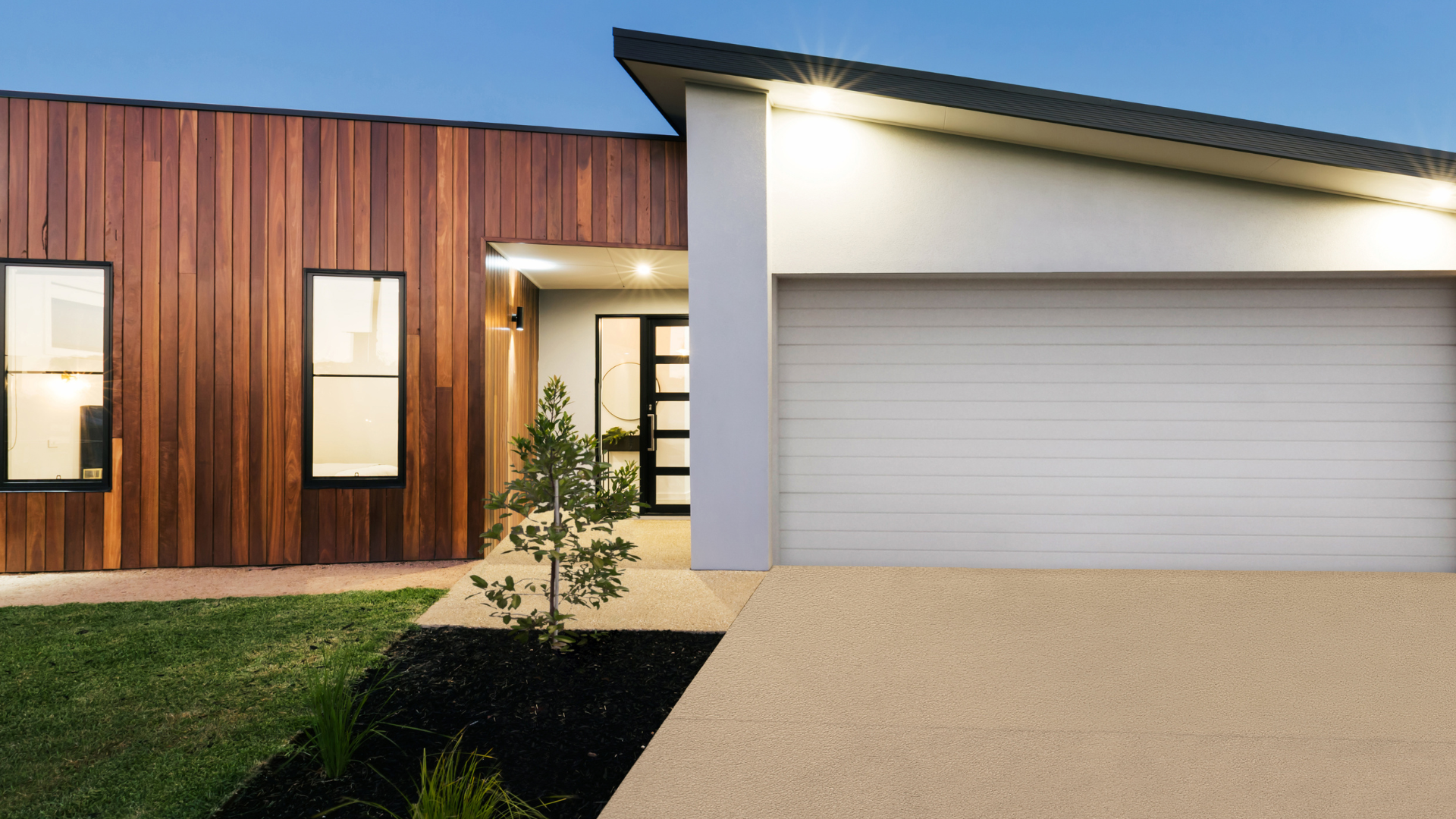 A modern house with a large garage door